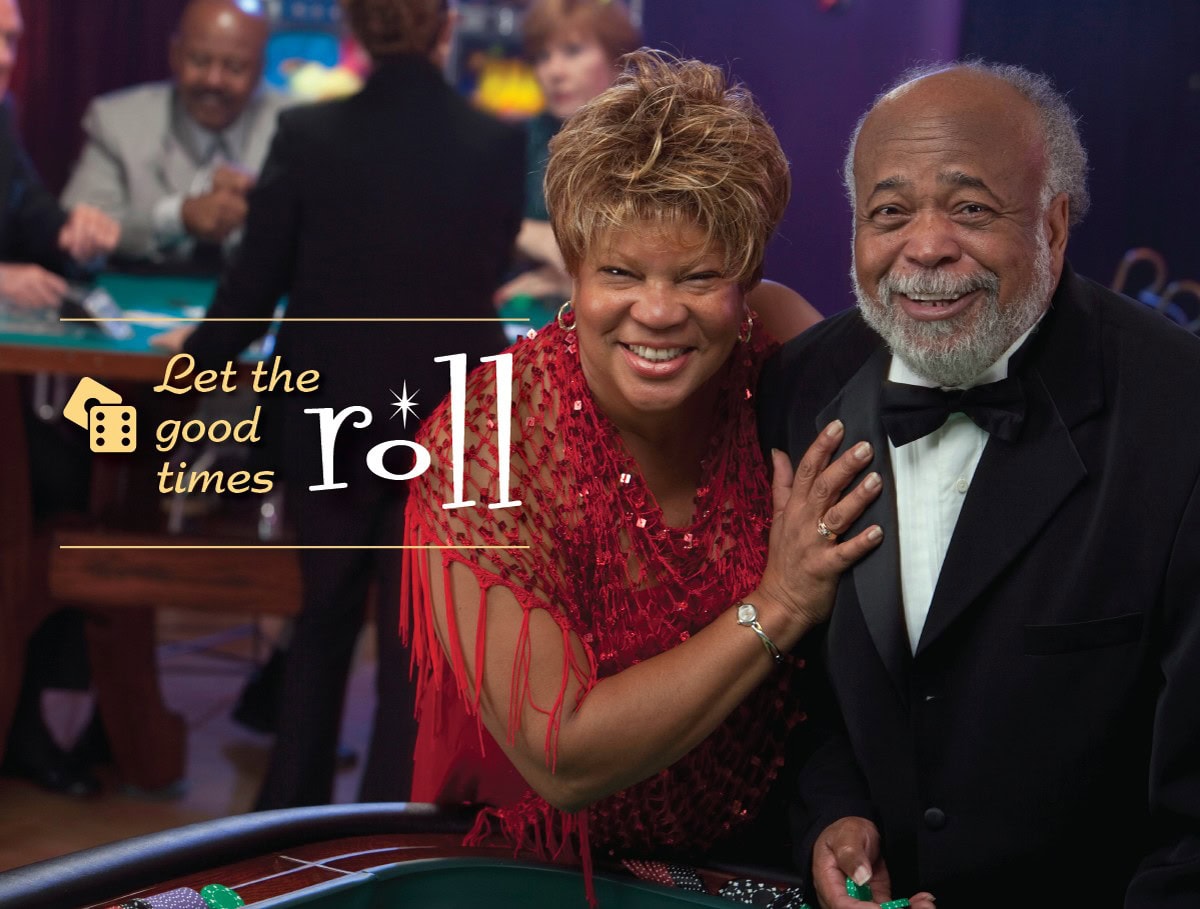 Let the good times roll. Senior couple at the craps table