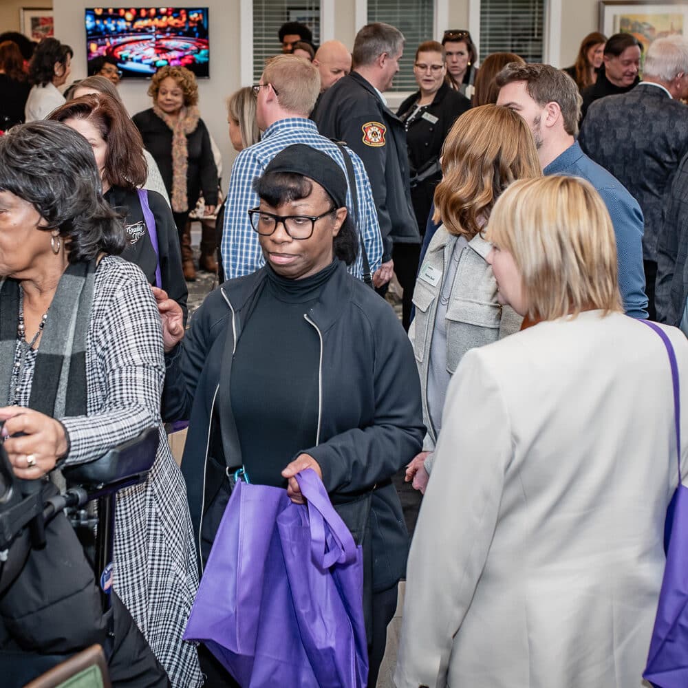 People bustling at the Grand Opening Party